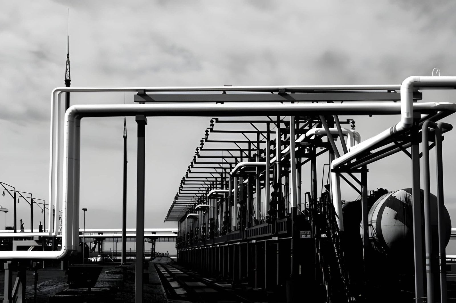 Modern industrial pipeline infrastructure connecting storage tanks and marine terminal facilities